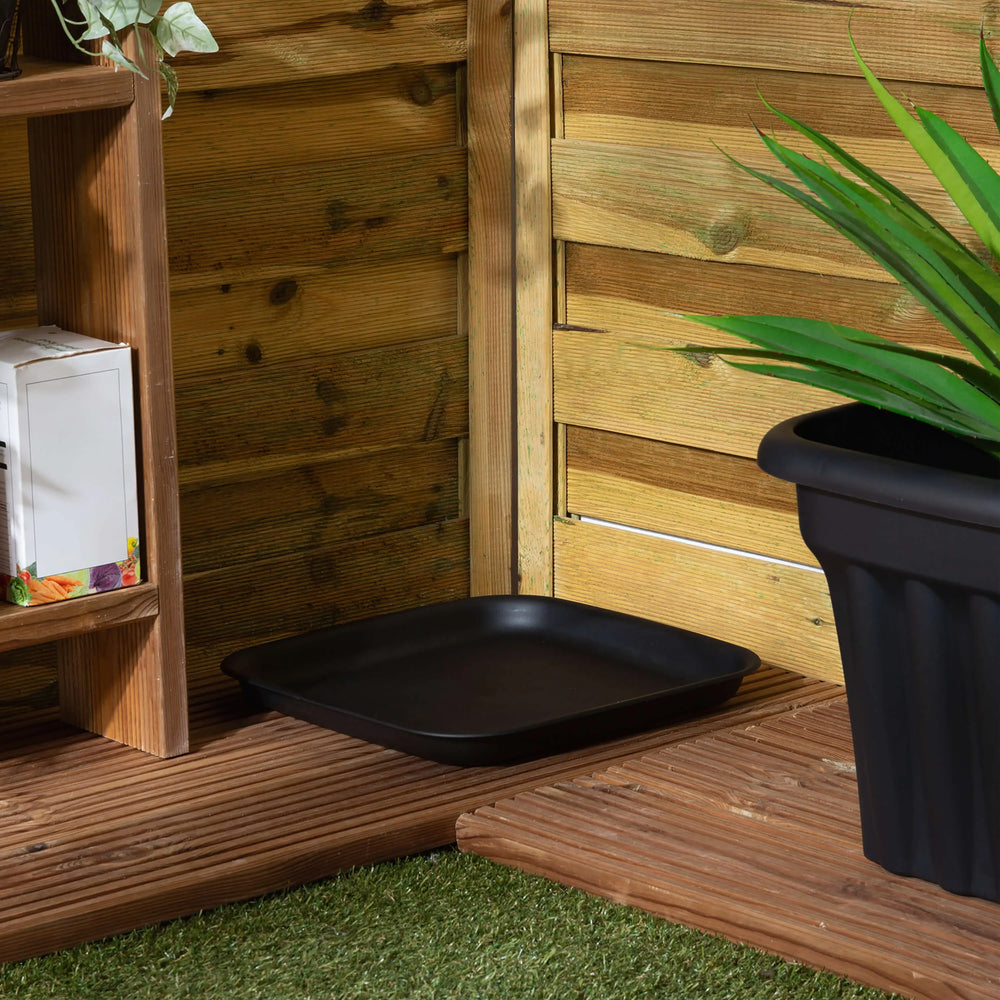 Black tray on a wooden deck with a potted plant and wooden shelf in the background.